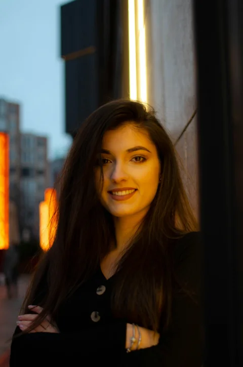woman in black shirt smiling