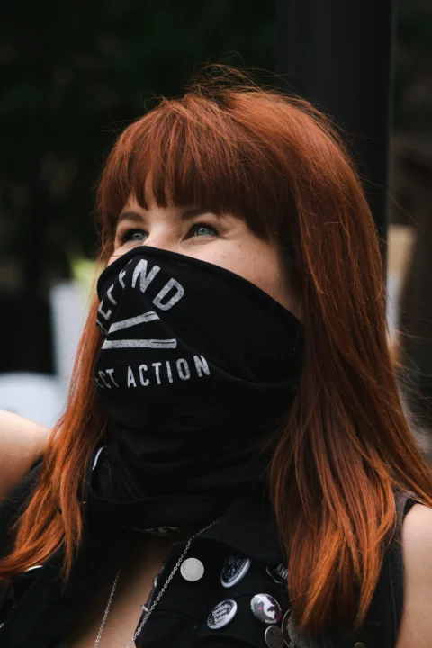 woman in black and white adidas shirt