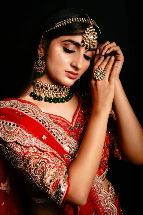 a woman wearing a red dress and a crown